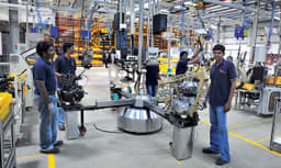 Ergonomic workstations and programmed power tools enable workers to build bikes quickly and accurately. 